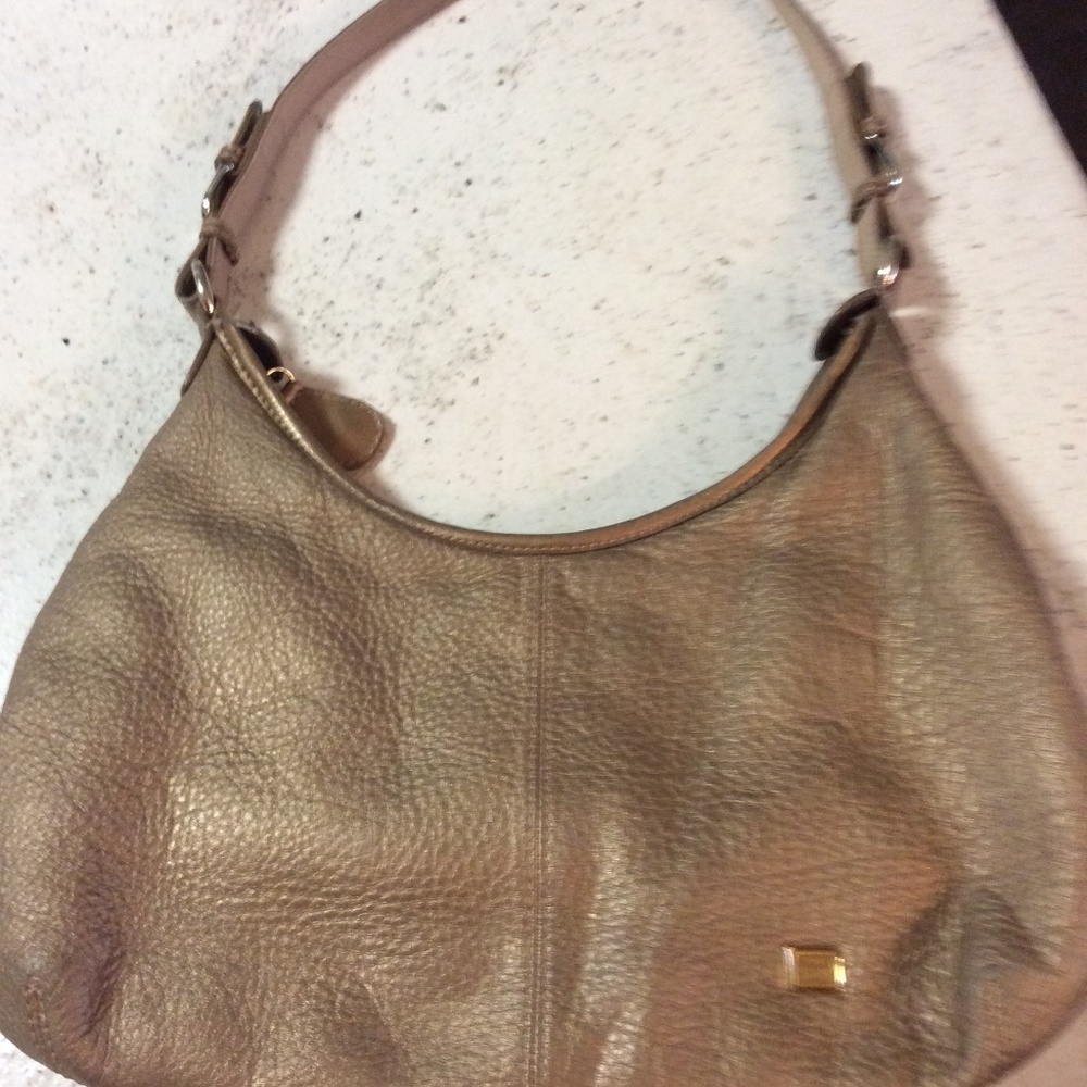 The Sak gold leather hobo bag